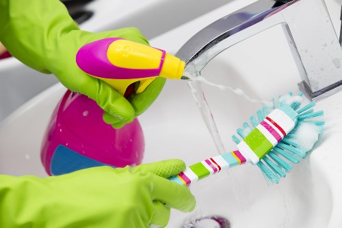 Deep cleaning equipment used on a fabric armchair in Putney