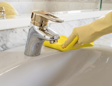 Local carpet cleaner treating stains in a Putney living room